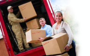 People unloading a moving van.